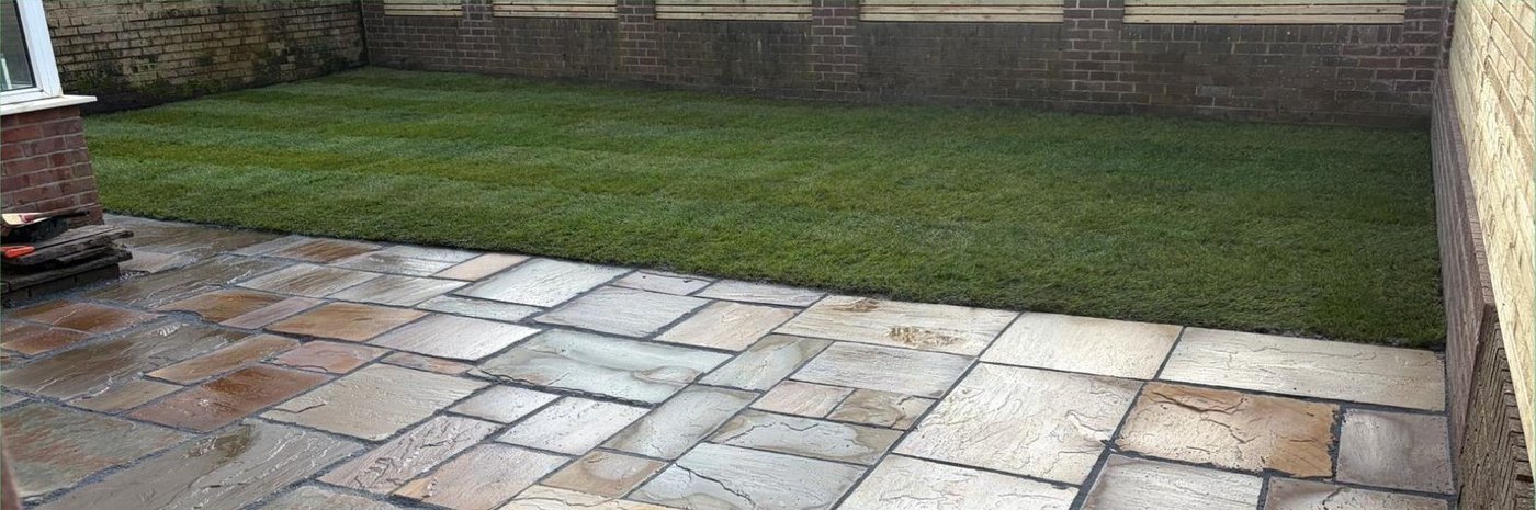 Finished Indian sandstone patio and new lawn in the completed rear garden
